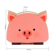 Side view of piglet book lamp showcasing light and design